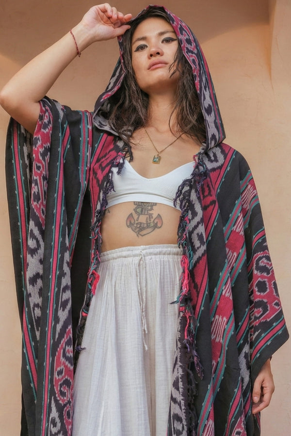 Mimpi Hooded Poncho Cape — Women's Red Teal, handwoven Javanese Ikat, front view