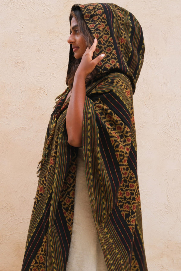 Mimpi Hooded Poncho Cape — Women's Jungle Gold, close detail of the hand-dyed Ikat weave
