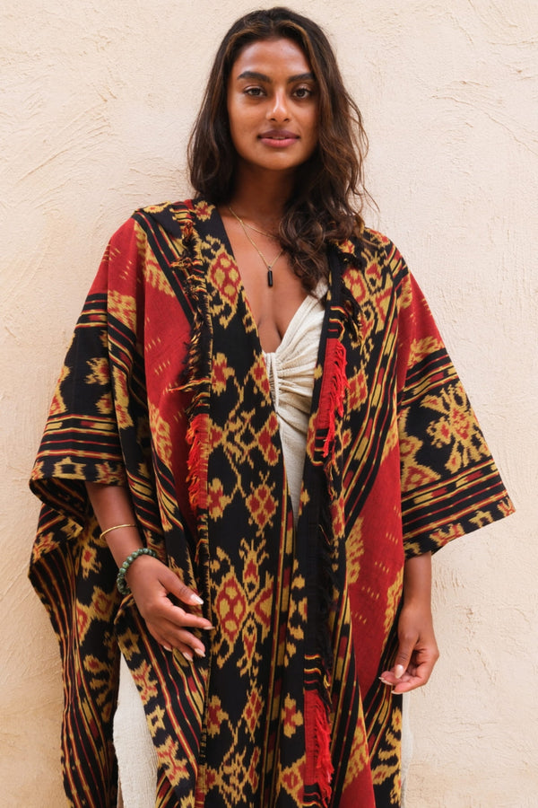 Mimpi Hooded Poncho Cape — Women's Red Gold, handwoven Javanese Ikat, front view