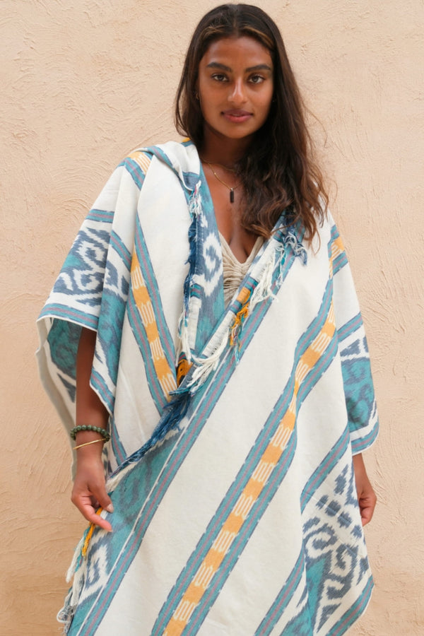 Mimpi Hooded Poncho Cape — Women's Teal Tribal, handwoven Javanese Ikat, front view