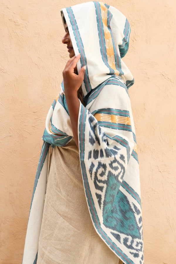 Mimpi Hooded Poncho Cape — Women's Teal Tribal, close detail of the hand-dyed Ikat weave