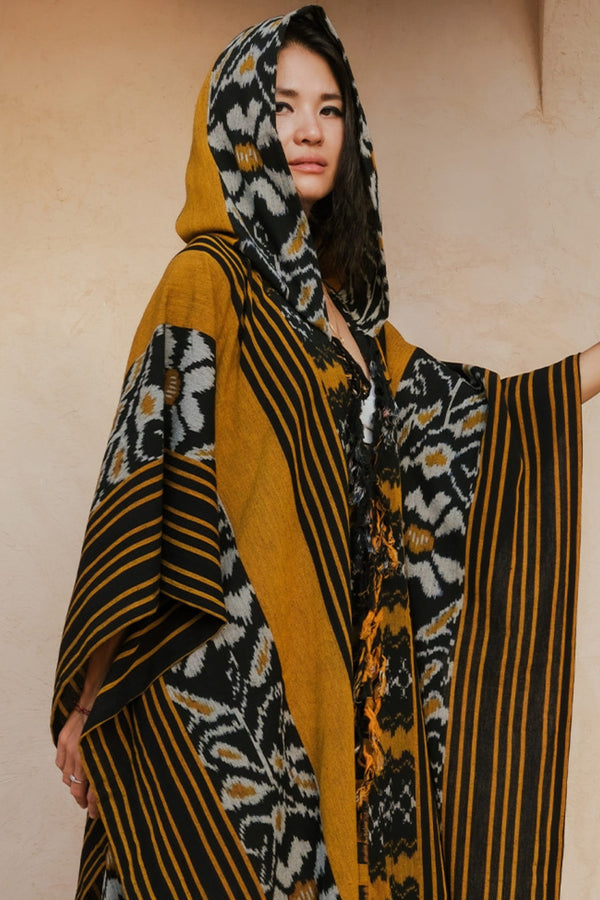 Mimpi Hooded Poncho Cape — Women's Yellow Flower, handwoven Javanese Ikat, front view