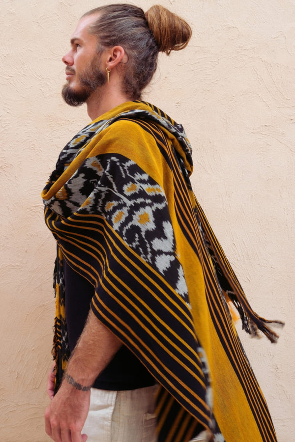 Mimpi Hooded Poncho Cape — Men's Yellow Flower, close detail of the hand-dyed Ikat weave