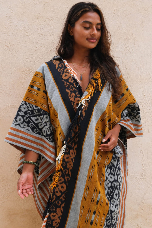 Mimpi Hooded Poncho Cape — Women's Yellow Tribal, handwoven Javanese Ikat, front view