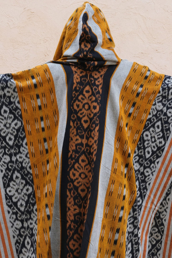 Mimpi Hooded Poncho Cape — Women's Yellow Tribal, handwoven Javanese Ikat, front view