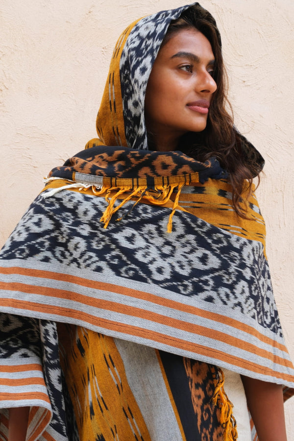 Mimpi Hooded Poncho Cape — Women's Yellow Tribal, handwoven Javanese Ikat, front view