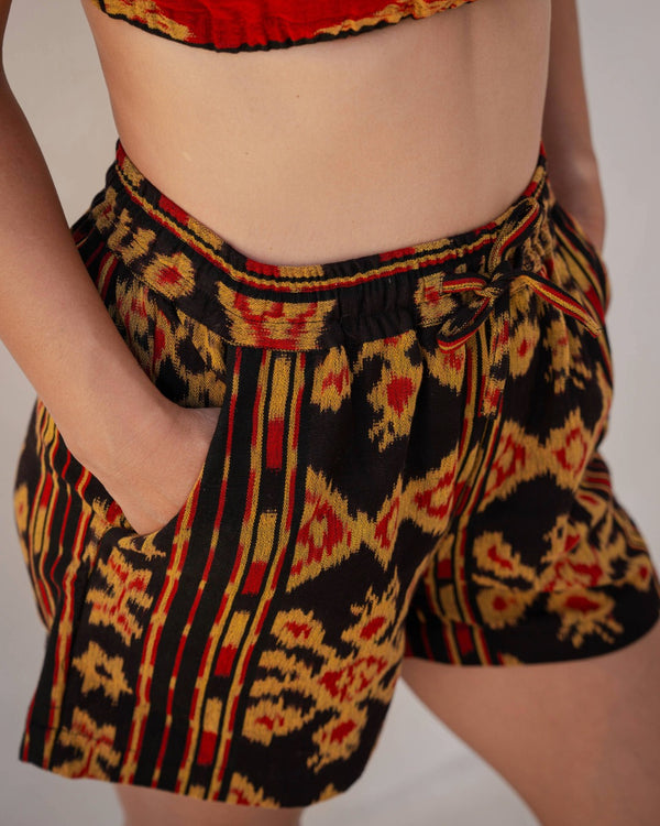 Sini Sana Two-Piece Set — Red Gold, handwoven Javanese Ikat, full-length styling